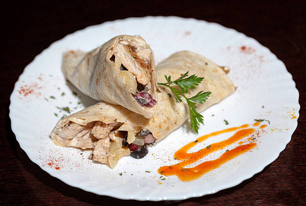 istock tortilla wraps with meat on wooden background 520890571