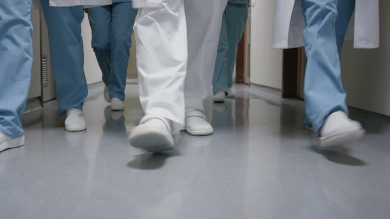 DS Legs of a medical team walking down the hospital hallway