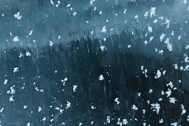 istock snowflakes is on the surface  of ice 520910561