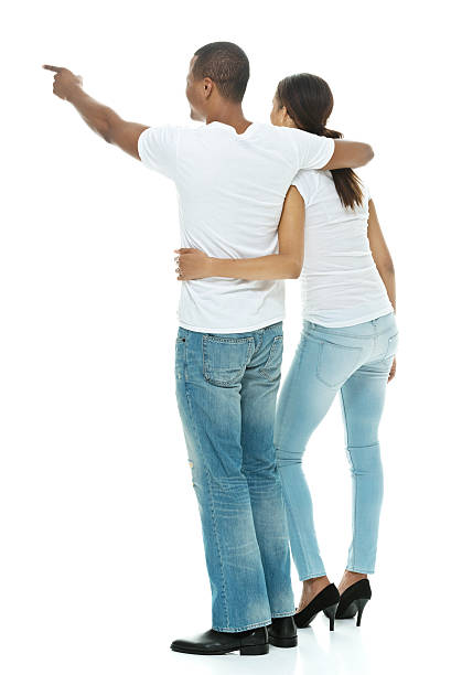 istock Rear view of couple pointing away 520911221