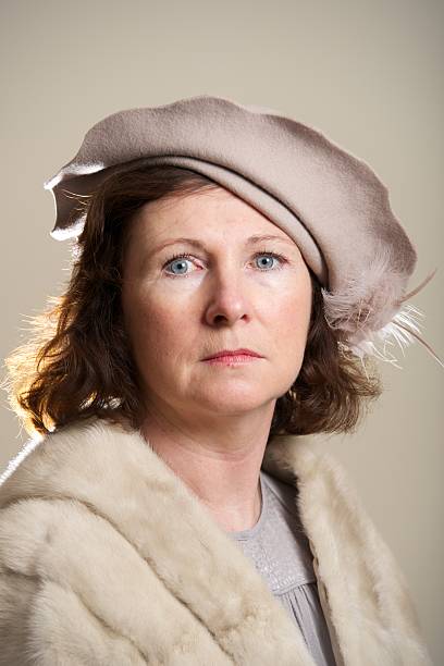 istock Brunette in taupe hat and fur stole 520913817