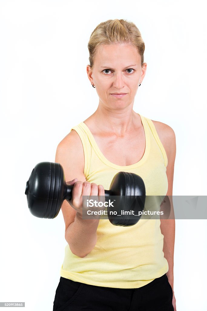 young fitness woman fitness woman lifting dumbbells. Activity Stock Photo