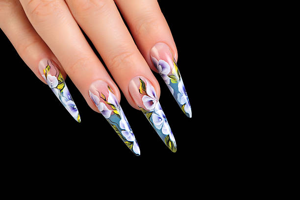 istock Female hand with manicure and beautiful design on nails.Isolated. 520915947