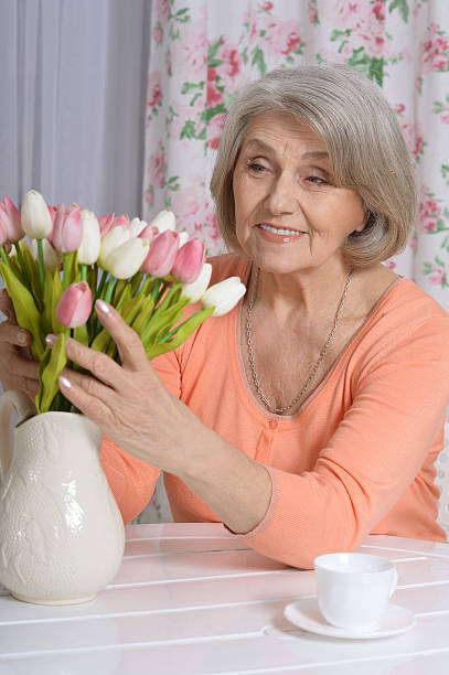 istock mature woman drinking tea 520934120