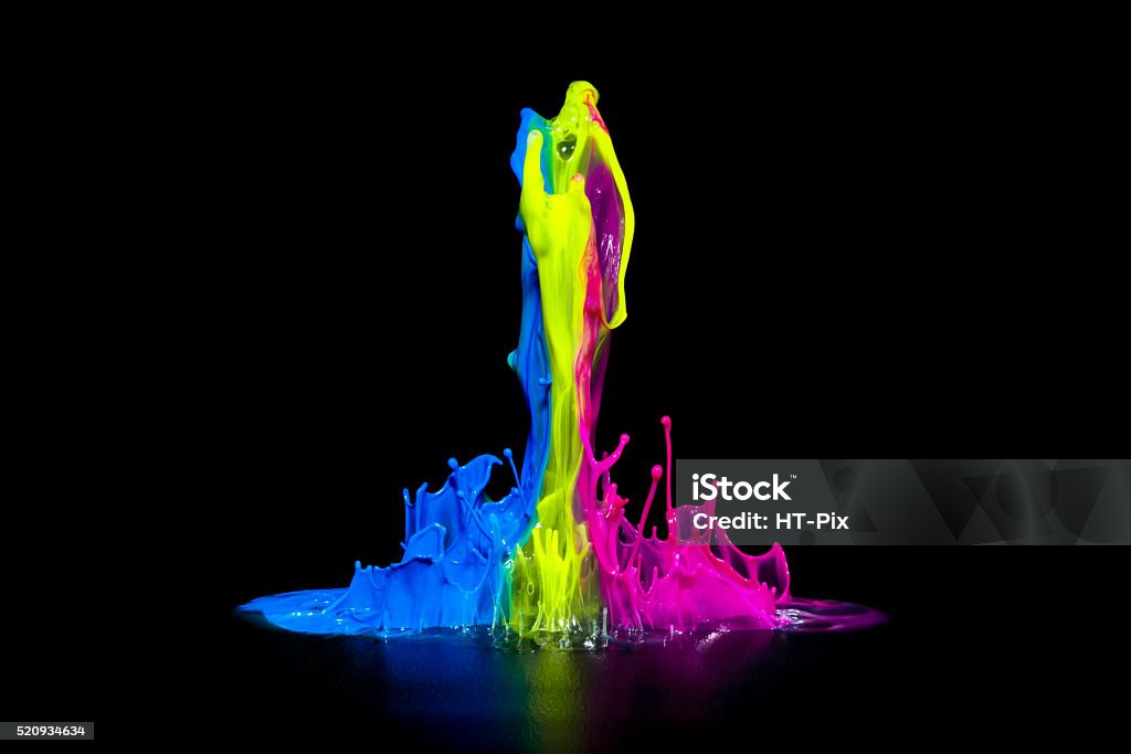 Colorful Paint Splashing - Paint on an Audio Speaker Colorful paint splashing on an audio speaker isolated on black. Paint Stock Photo