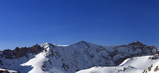 istock Panoramic view on snowy mountains in morning 520934744
