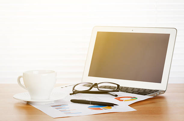 istock Office workplace with with laptop and coffee cup 520935698