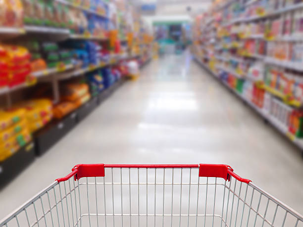 istock supermarket shelves aisle blurred background 520935756