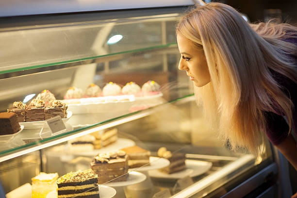 istock Young woman choosing sweets 520936032