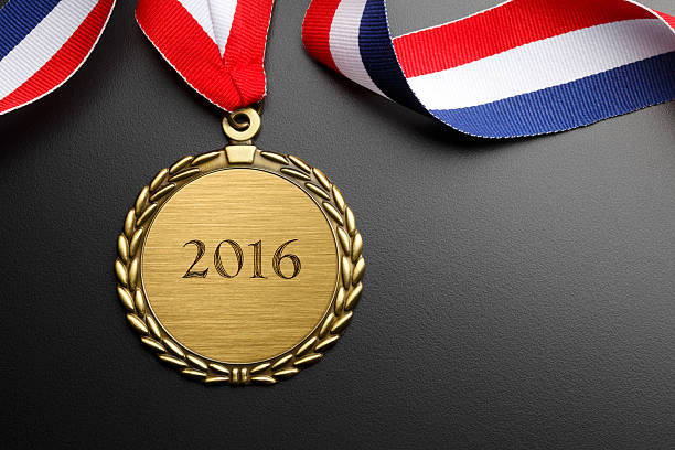 istock Gold Medal Inscribed With 2016 On Dark Gray Background 520936802