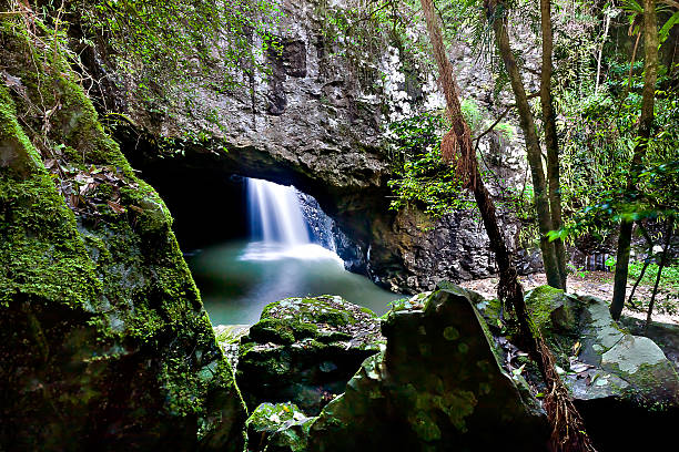 istock Close up of rocks and a waterfall in the cave 520937068