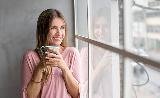 istock Casual woman at home drinking coffee 520937760