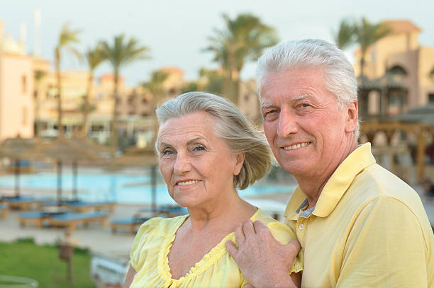 istock Senior couple near pool 520938062