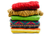 Stack of various sweaters. Winter style