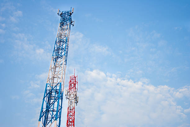istock Two antenna for mobile phone communication in clear blue sky. 520939518