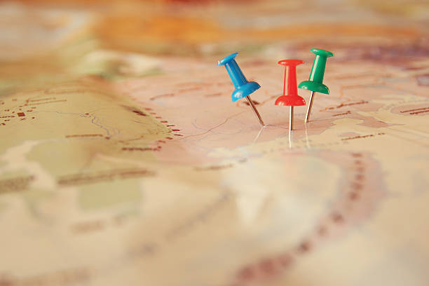 istock pins attached to map, showing location or travel destination 520940066