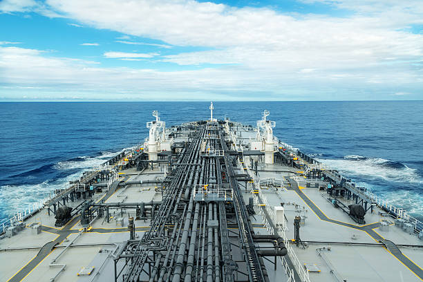 istock Grey and white tanker deck in blue sea 520940520