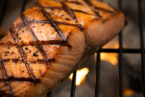 istock Grilled Salmon Filet Cooking on a Charcoal Grill 520940973