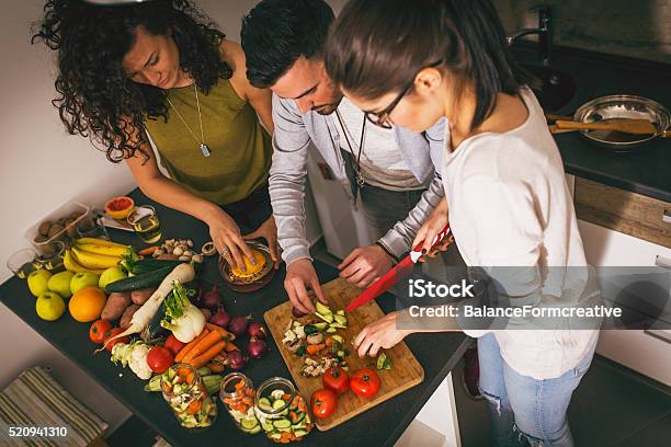 Preparing Food At The Kitchen Stock Photo - Download Image Now - Cooking, Togetherness, Friendship