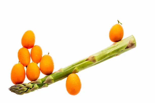 Photo of Seesaw Made From One Asparagus and Eight Kumquats