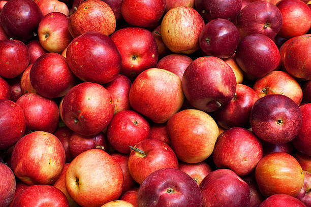 istock Closeup of packed red-ripe apples. 520941537