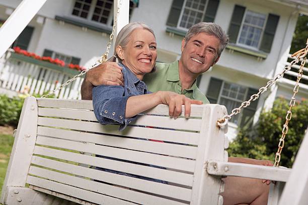 istock Happy couple on a bench 520943672