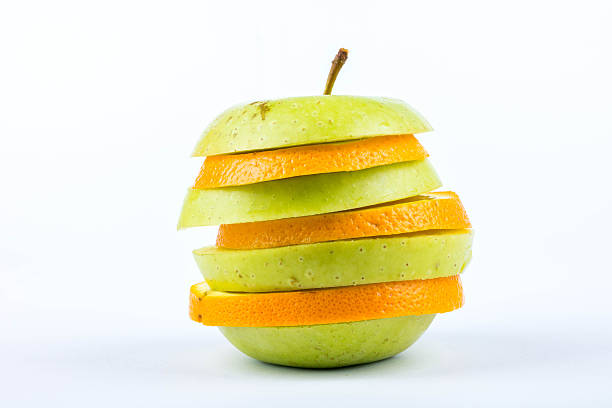 istock Slices of apple and orange 520943893