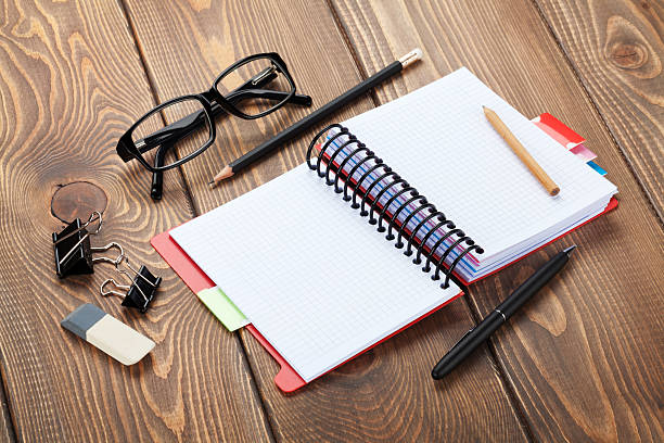 istock Office table with notepad, colorful pencils and supplies 520945495