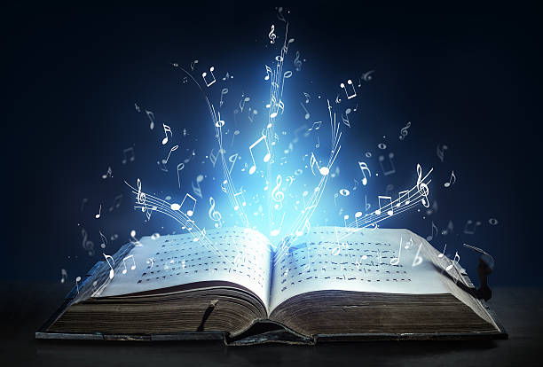 Classical Symphony Shines With Musical Notes From An Ancient Book Ancient book of the 14th century with sparkling musical notes choir photos stock pictures, royalty-free photos & images