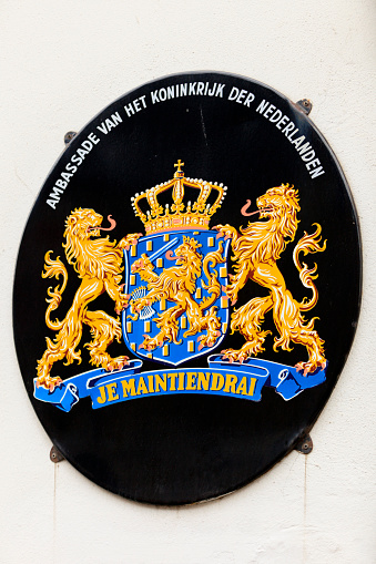 sign with the coat of arms of The Nerlands on the front door of the Dutch embassy in Copenhagen; Copenhagen, Denmark