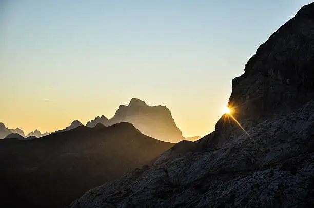 Stunning sunrise photo shot while hiking up Mount Marmolata (Marmolada). Marmolata is the highest mountain in the Dolomites (3343m). In the background you can see Monte Pelmo.