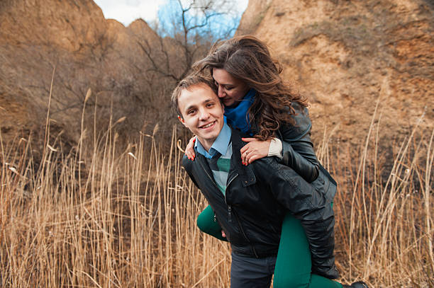 Happy couple smiling outdoors on hiking trip in the mountains