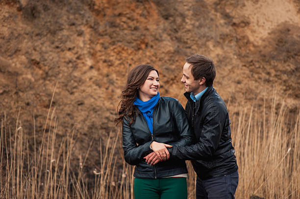 istock Happy couple smiling outdoors in the mountains 520949220