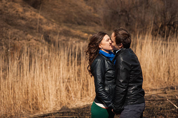 Happy couple smiling outdoors on hiking trip in the mountains