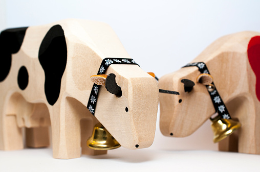 Swiss wooden toys cows with bells, red and black