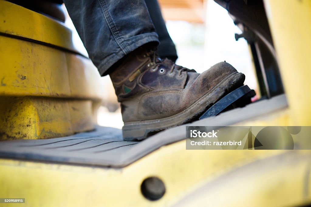Close up of workboots of man driving forklift Boot Stock Photo
