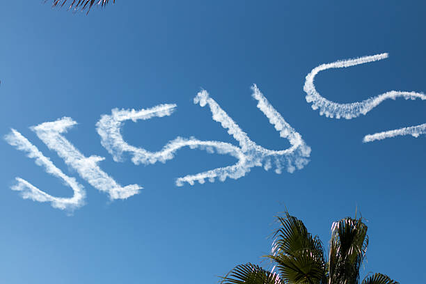 иисус written in the sky - skywriting стоковые фото и изображения