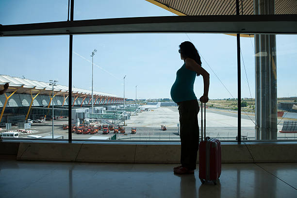 pregnant waiting to fly stock photo