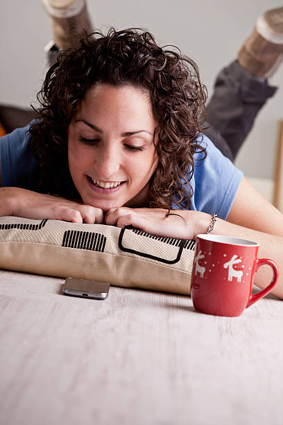 istock Christmas texting for a happy girl 520959865
