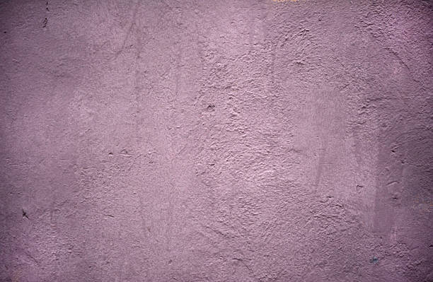 istock Texture of wall covered with lilac stucco 520960393