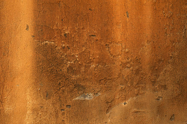 istock Texture of wall covered with yellow stucco 520960439