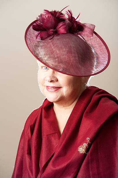 istock White-haired woman in red hat and scarf 520961945