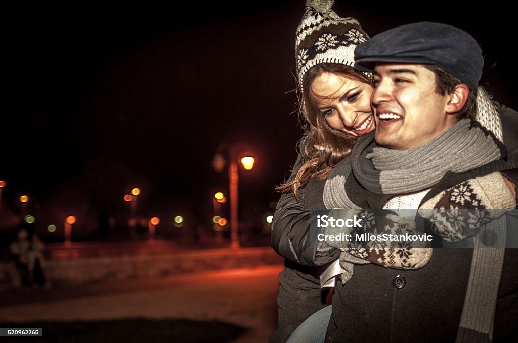 Young couple in love outdoor Beautiful young couple in love enjoying a winter night 20-29 Years Stock Photo