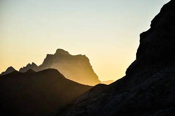 Stunning sunrise photo shot while hiking up Mount Marmolata (Marmolada). Marmolata is the highest mountain in the Dolomites (3343m). In the background you can see Monte Pelmo.