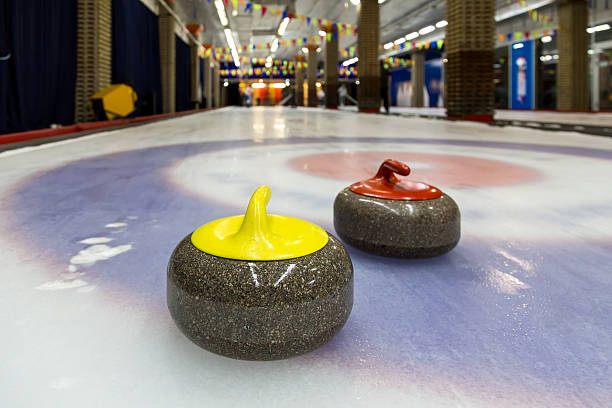 istock Curling stones on an indoor rink 520964023