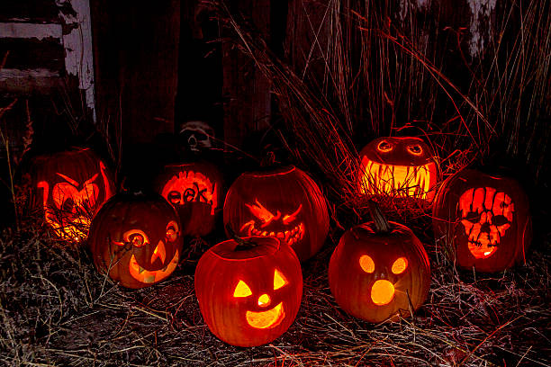 istock Lighted Halloween Pumpkins with Candles 520964259