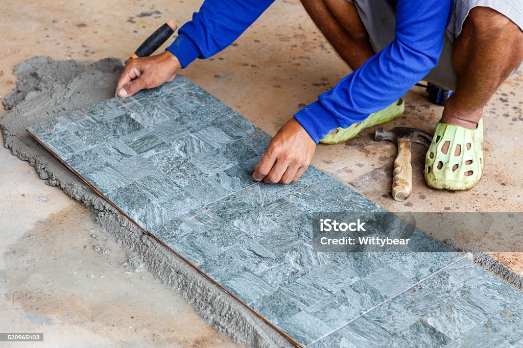 floor tile installation for house building Adult Stock Photo