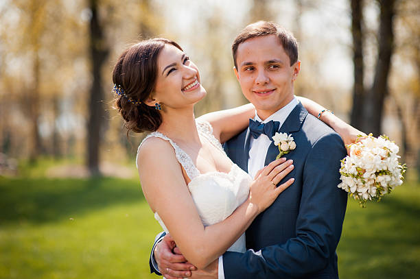 istock Bride and groom walking at the river 520970488
