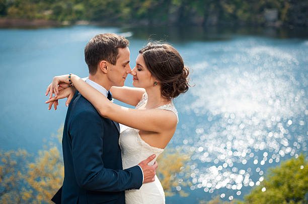 Bride and groom walking at the river
