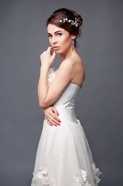 istock Elegant bride with short hair updo and bare shoulders 520971496